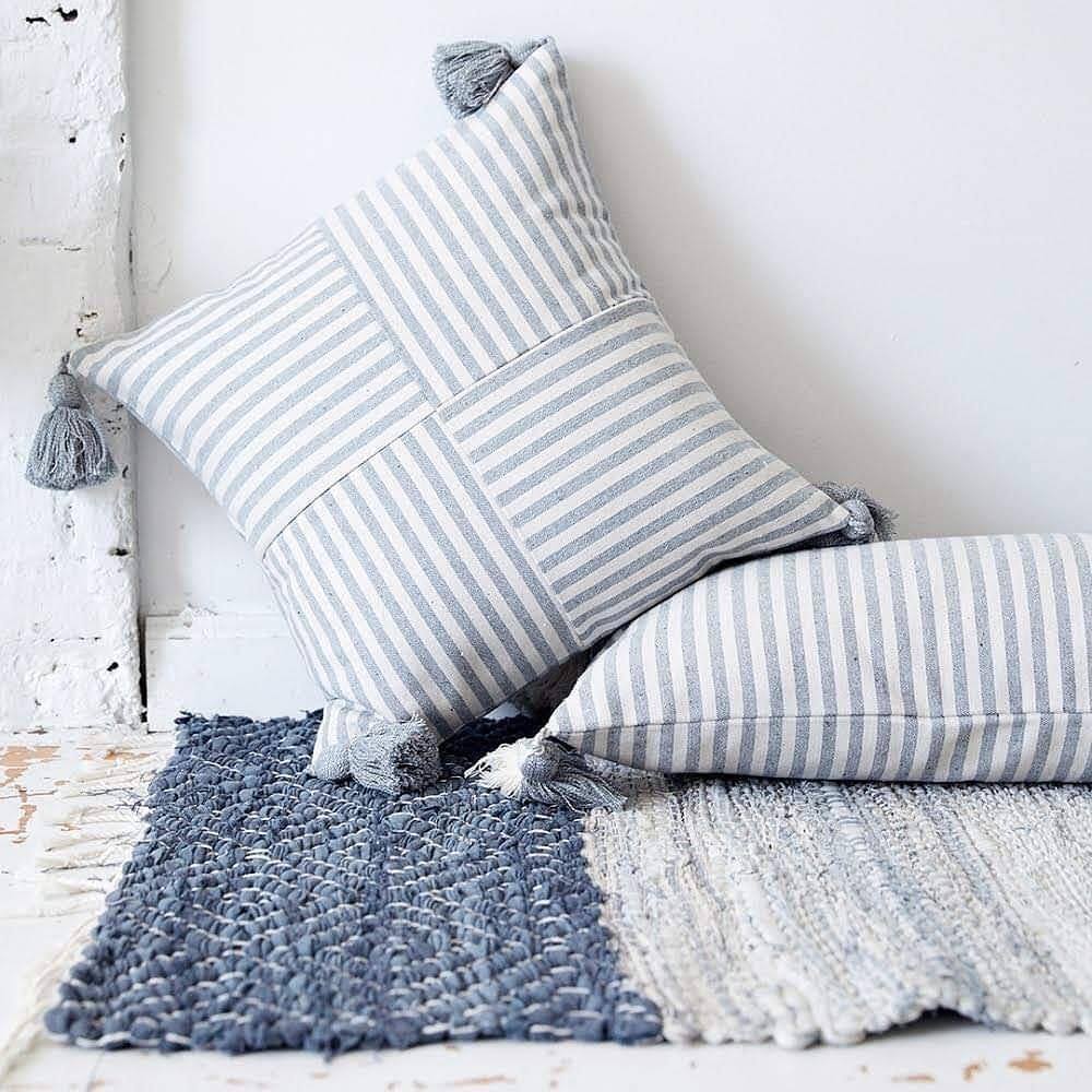 Monochromatic Stripe pattern Cushions with a woven rug