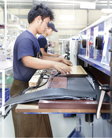 Men working in Vietnam clothing manufacturing company
