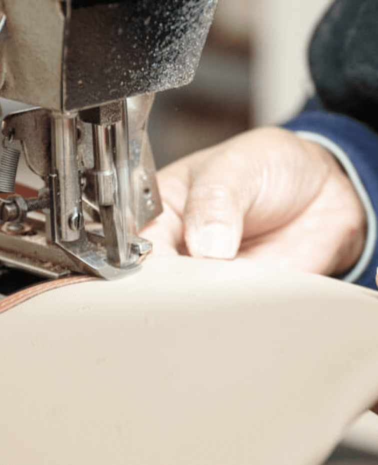Leather stitching in a factory